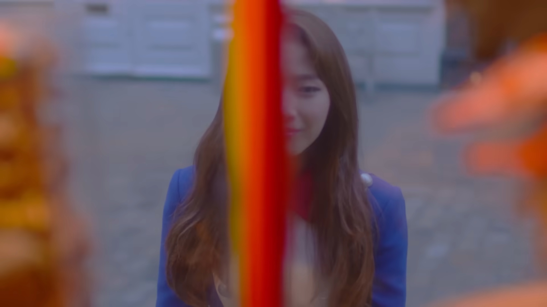 Haseul looking through a window.